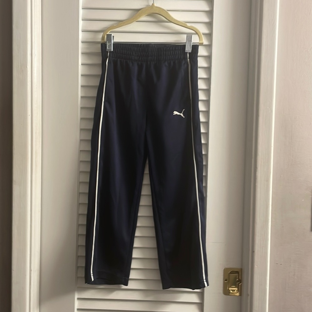 Puma Iconic Track Pants;Youth7,Navy w/double white pin vertical stripes on legs.